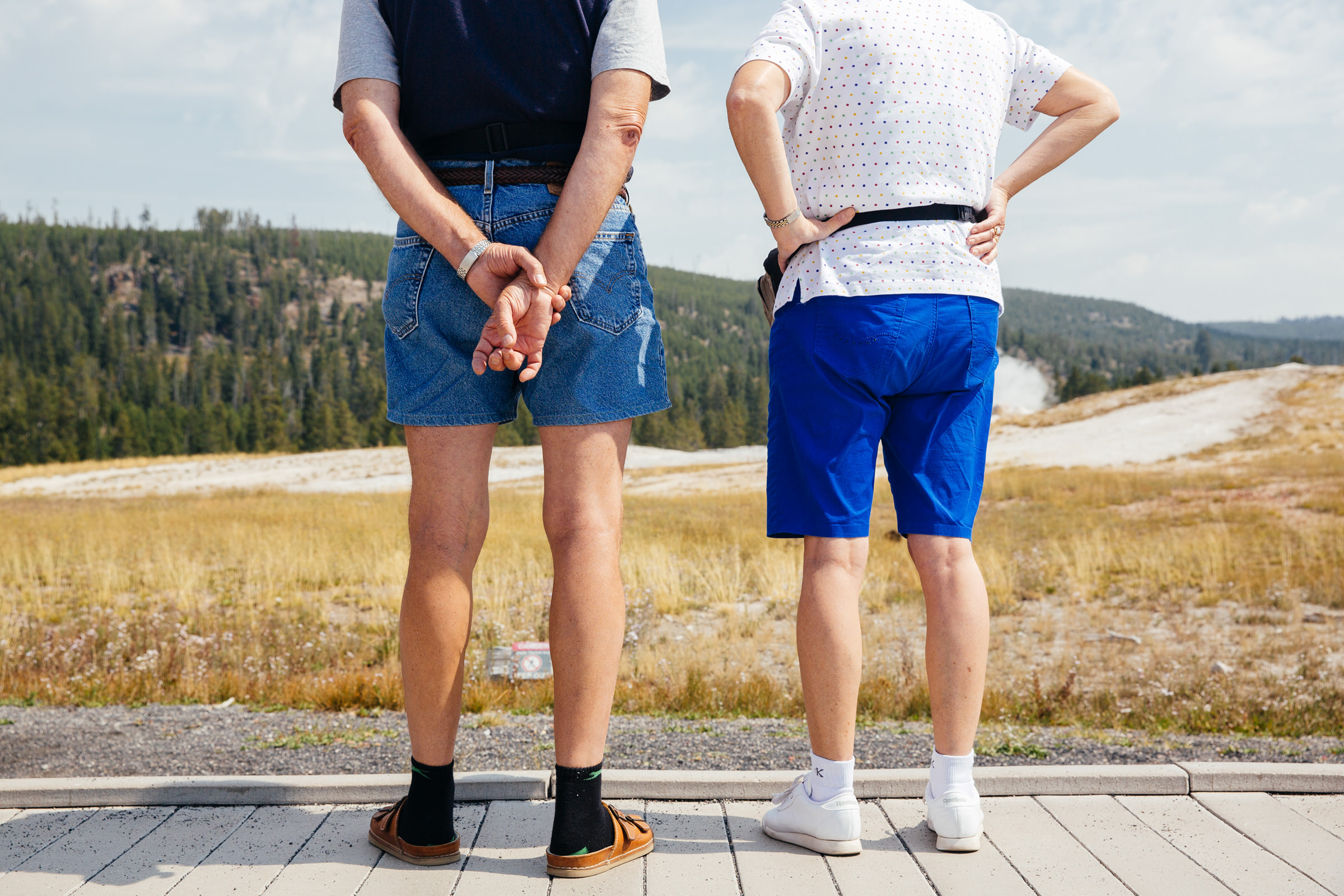 Tourists at Old Faithful Geyser, Yellowstone National Park.