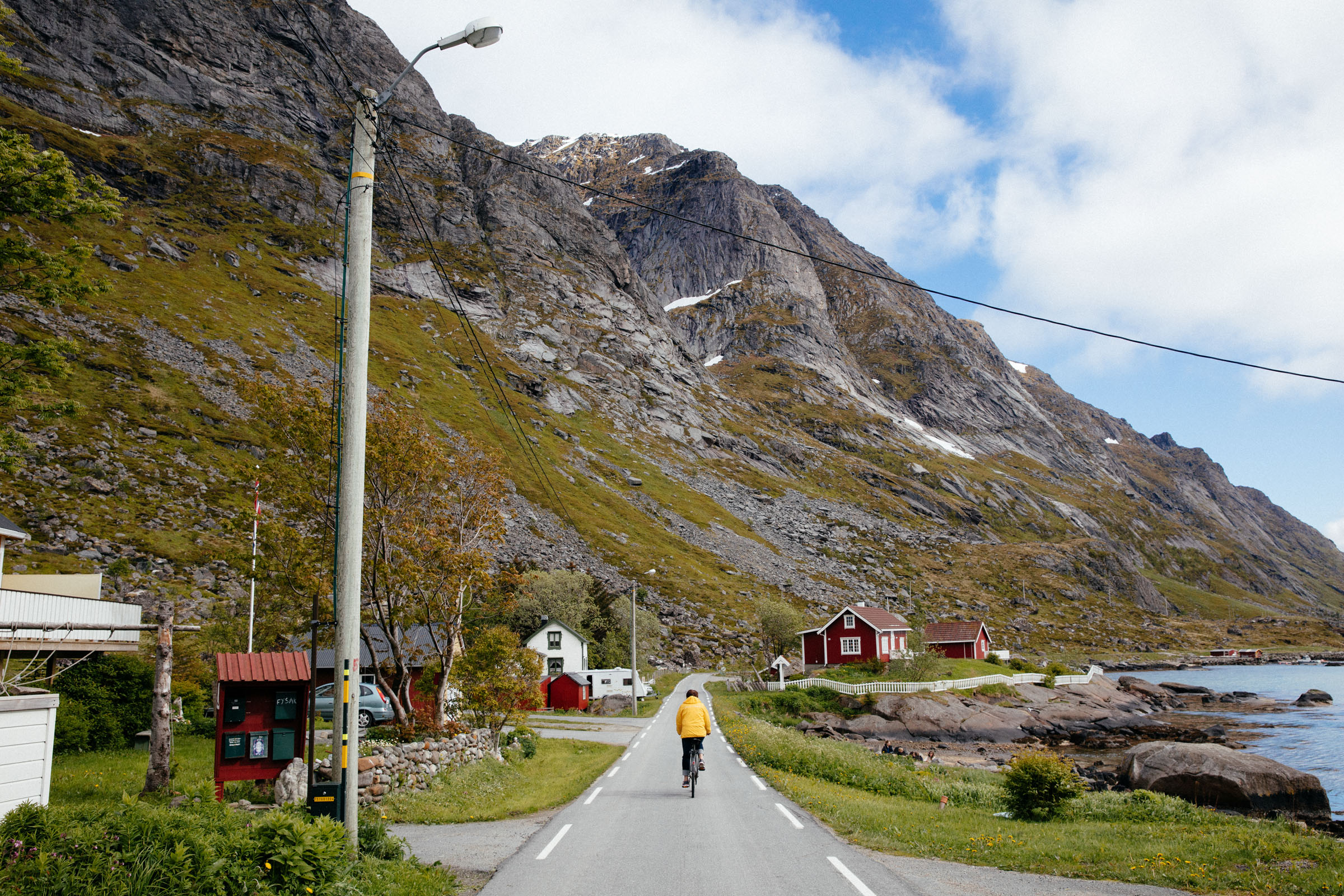 Cyclist on the road in the Lofoten Islands, Norway.